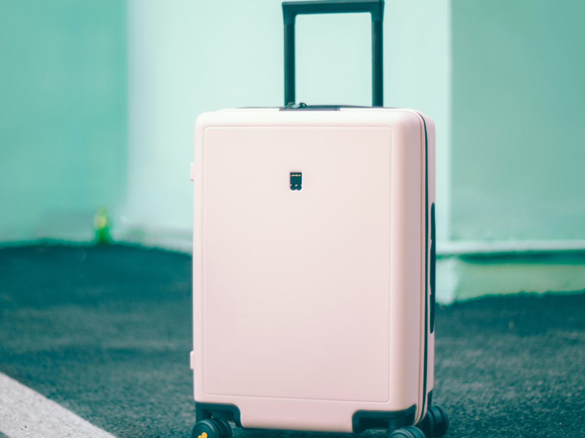 Man With Shoulder Bag And Hand Luggage Walking In Airport Terminal Stock  Photo - Download Image Now - iStock